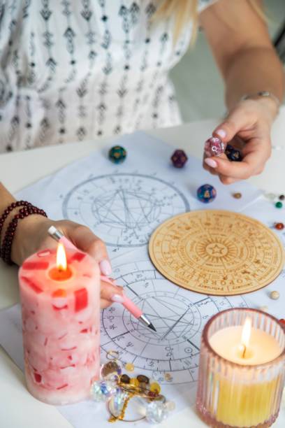 istock Woman numerologist astrologer counts numbers. Selective focus 2202748931