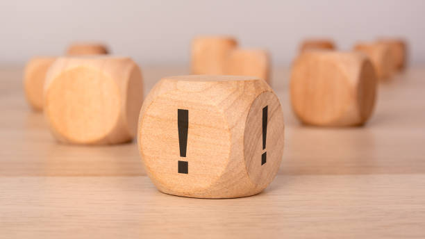 istock wooden cube with exclamation marks, symbolizing urgency, warning, or important information 2202750028