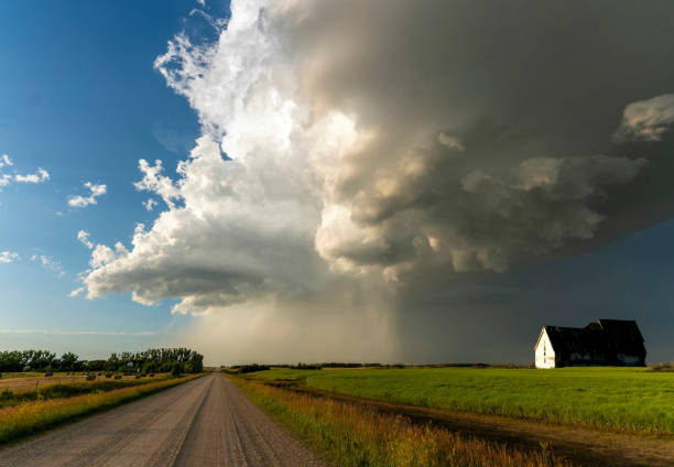 Dramatic supercell storm clouds forming over a farm in the canadian prairies
