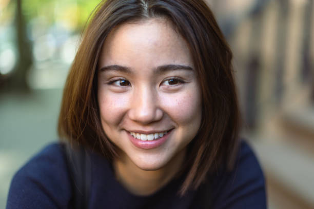 istock Smiling Woman Outdoors in Daylight 2202751238