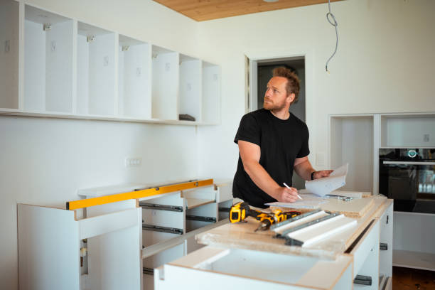 Caucasian Mid-Adult Man Working on Kitchen Assembly