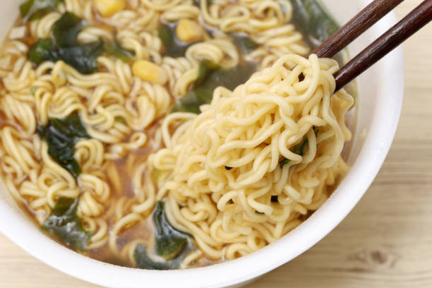 istock instant noodles in a cup with chopsticks 2202755751