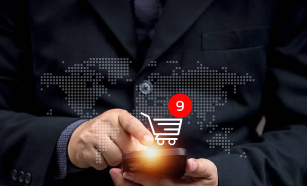 istock Man buys things online using his mobile phone or laptop. online transactions via application. Online shopping via bank transfer or credit card. Connection by internet. Security safe. 2202759280