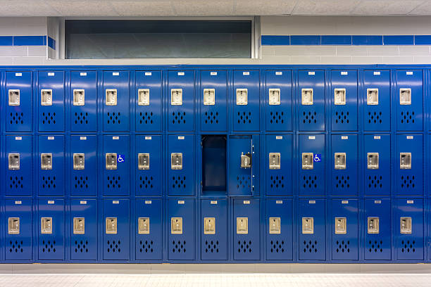 istock Empty team locker, locker room, changing room, with an open locker, with traditional blue metal lockers. 2202760149