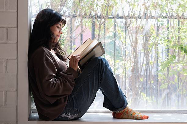 istock latina female student studying at home 2202760317