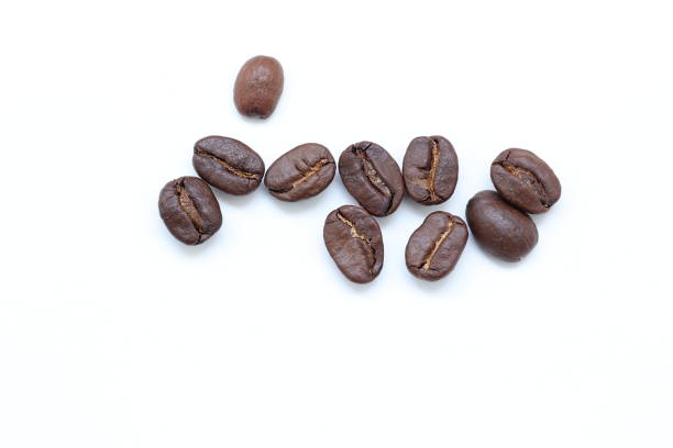 istock Top view of brown coffee beans on white background 2202760449