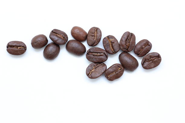 istock Top view of brown coffee beans on white background 2202760450