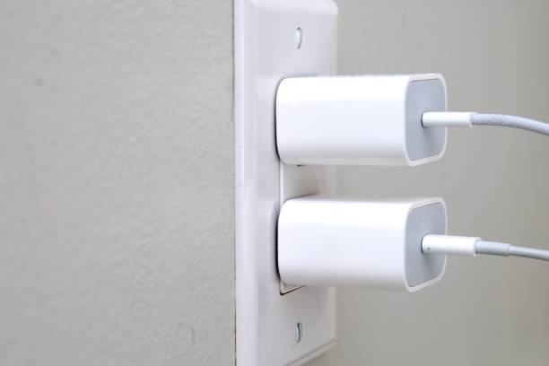 istock Phone charger plugged into a power outlet 2202763623