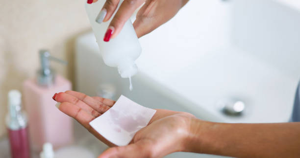 istock woman drip toner on cotton 2202768772