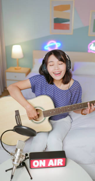 istock woman live broadcasting at home 2202768836