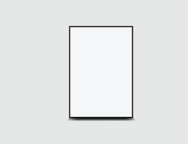 istock Realistic blank paper posters mockup with black frame and shadow isolated on background. Design poster template for presentation artwork, picture, advertising, banner, exhibition. Vector illustration 2202769352