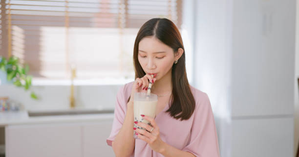 istock woman drink bubble tea home 2202773183