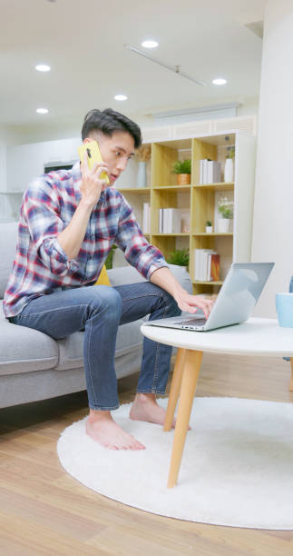 istock asian man remote work home 2202776319