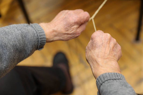A close-up of elderly hardworking hands in a nursing home.