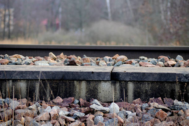 A railway with a lot of stones around it