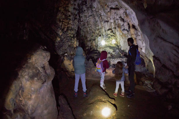 istock Family exploring cave 2202777600