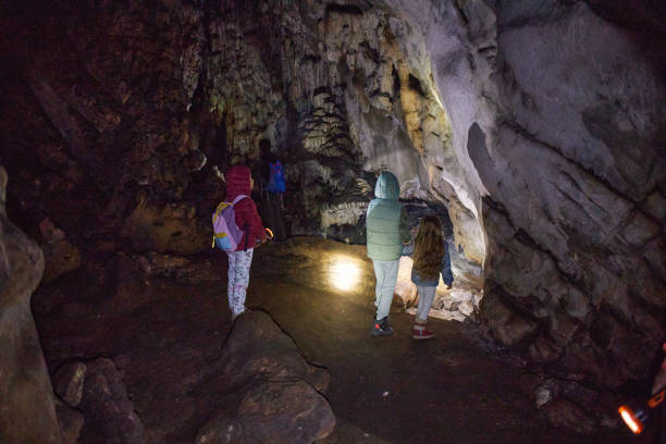istock Family exploring cave 2202778017