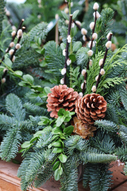 istock A grave flower decoration with pinecones 2202778445