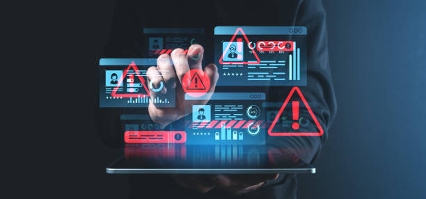 istock Digital security warning concept with alerts and personal ID information on holographic interface in dark setting. 2202783911