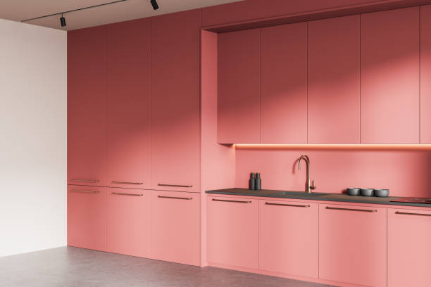 istock Modern pink minimalist kitchen interior with sleek cabinetry and stylish lighting. 3D Rendering 2202786204