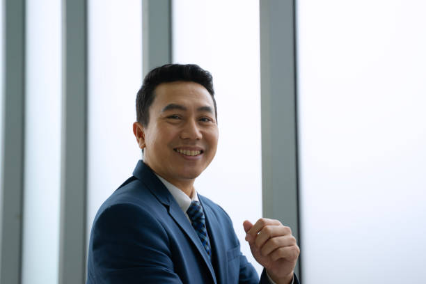 istock White collar worker is working with team at office. 2202786254