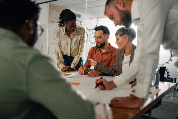 istock Businesspeople collaborating on project during office meeting 2202789106