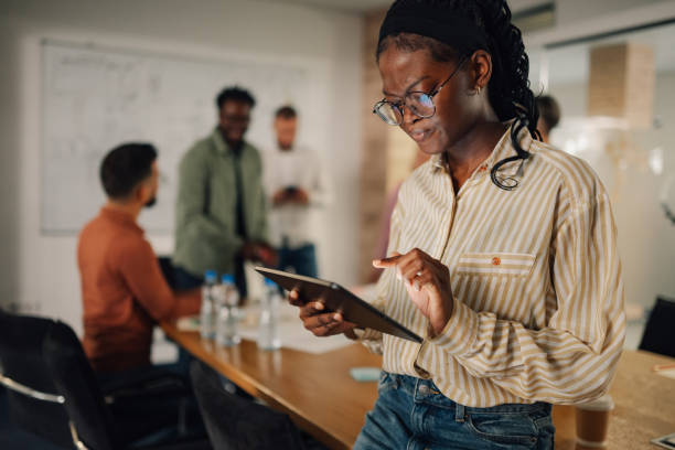 istock Project manager using digital tablet during meeting in office 2202789149