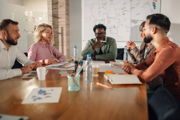 istock Marketing professionals collaborating on project during meeting 2202789215