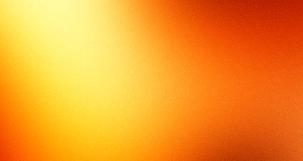 istock Grainy gradeint orange yellow blurred abstract retro noise texture background 2202789533