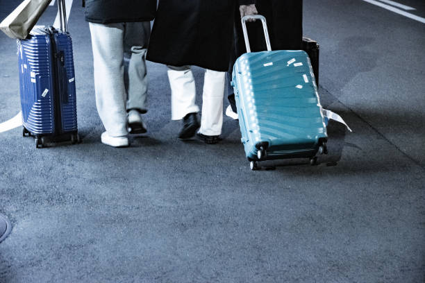 Traveling with a red suitcase at the airport