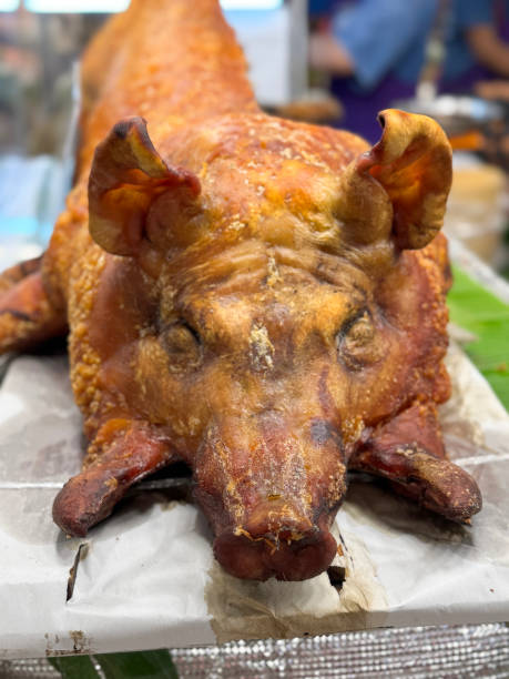 istock Image of experience the ultimate culinary spectacle with slow roasted hog, pig’s head, roasted, tender pulled pork 2202790892