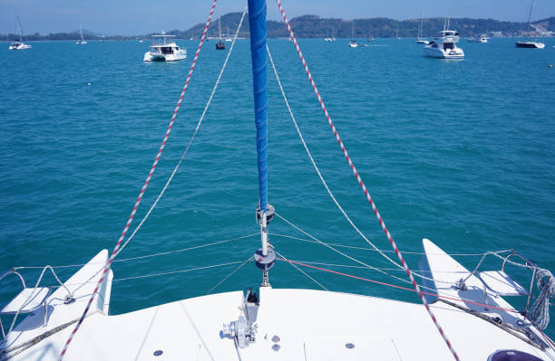 istock A white voyage boat featuring a steering wheel floating in the water 2202791903