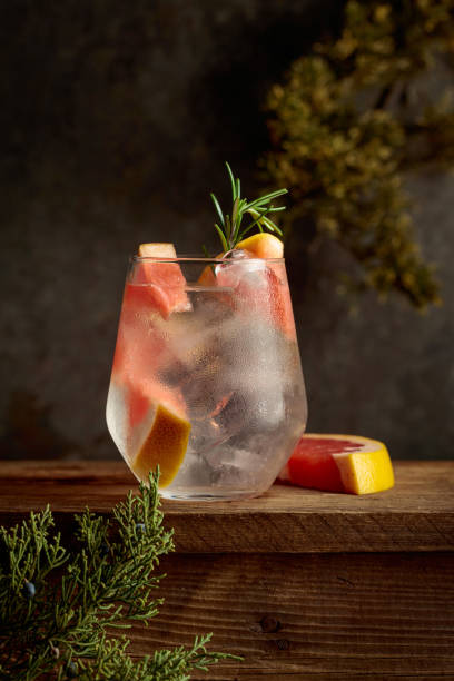 istock Cocktail: gin and tonic with ice, grapefruit, and rosemary. 2202793526