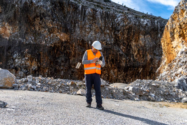 istock Engineer working in a stone quarry. Business and industry. 2202794411