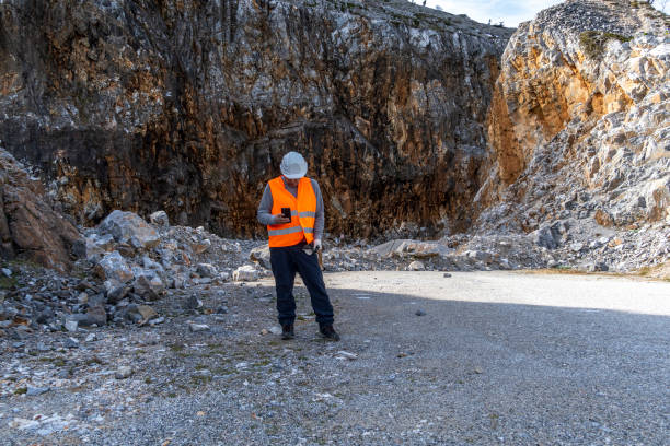 istock Engineer working in a stone quarry. Business and industry. 2202794423