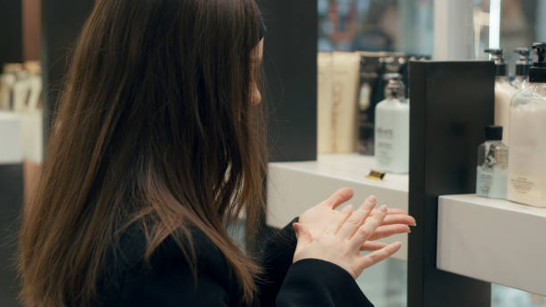 istock Woman testing hand cream in a beauty store 2202794740