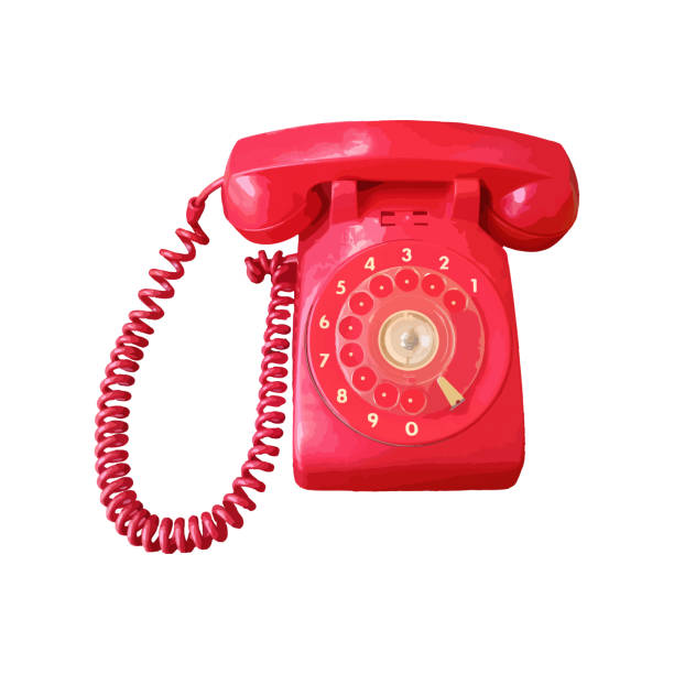 A pink old fashioned rotary style phone, photographed on a matching pink colored backdrop for a monochromatic style.