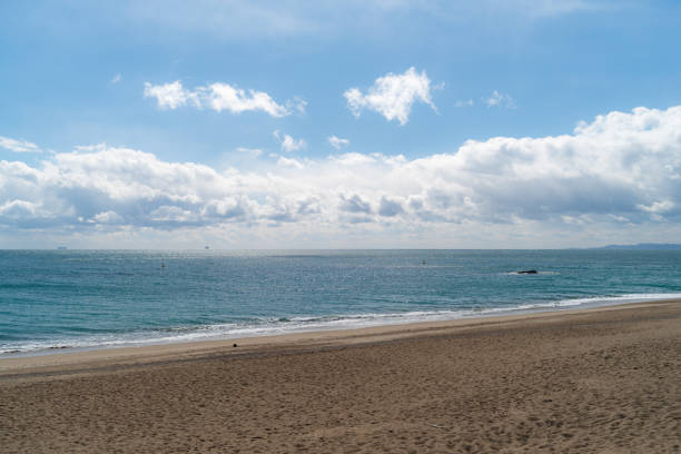 Clouds, sea, ocean, sand, water.