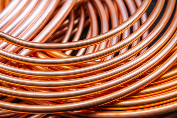 istock New copper twisted pipes of the same diameter. 2202795579