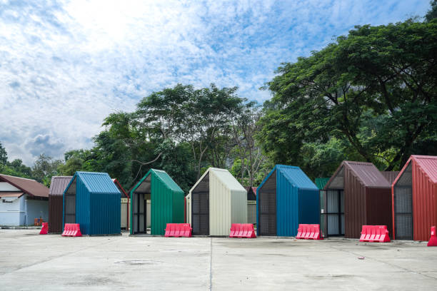 A kiosk's form is created by combining and constructing a metal sheet. It is set up for market weekend in the roll.