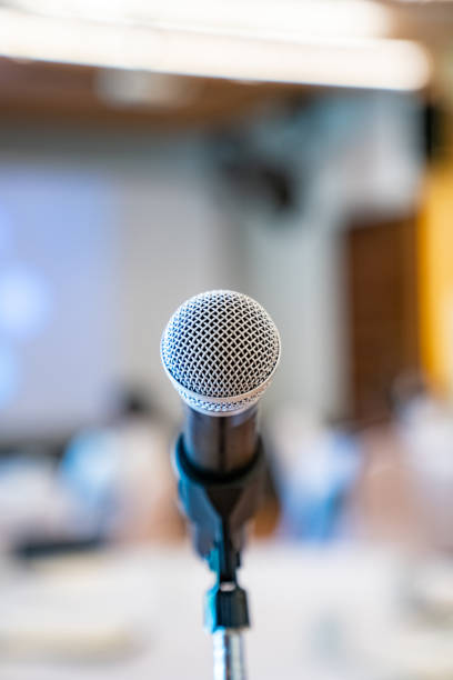 istock microphone is on microphone stand in seminar meeting room for everyone to use when speaking or greeting seminar participants. 2202804758