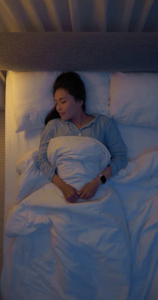 istock asian woman good sleep quality 2202812695