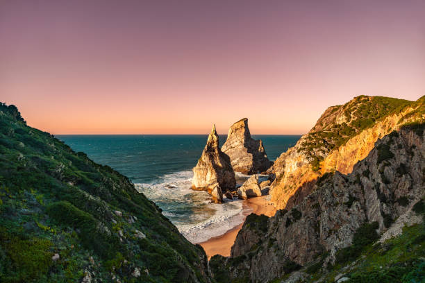 istock Wide View from Trail Overlooking Ursa Beach and Rocha da Ursa Rock Formation at Sunset, Portugal 2202813580