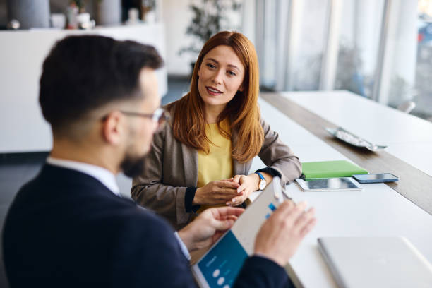 istock Business people discussing strategy during a meeting in a modern office 2202814204