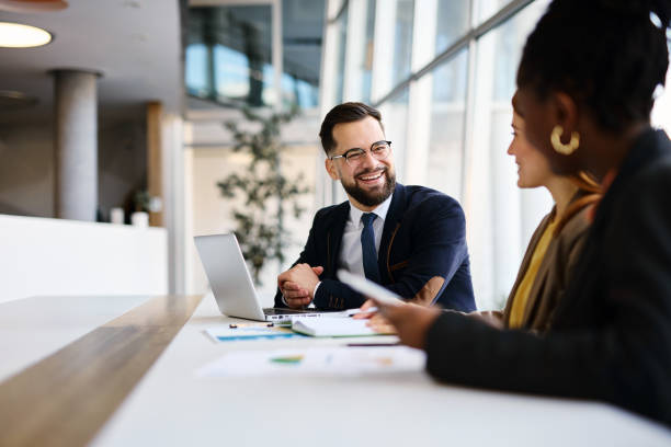 Business partners discussing strategy in modern office during meeting