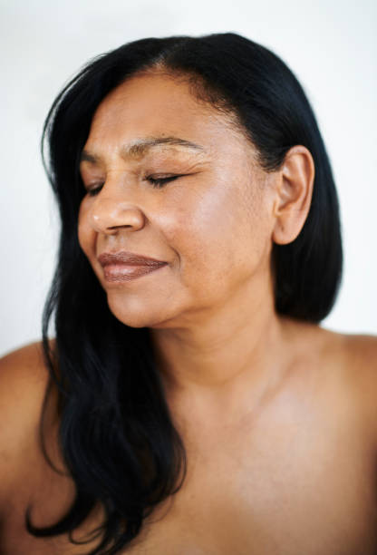 istock Serene Mature Woman with Closed Eyes and Peaceful Expression 2202814885