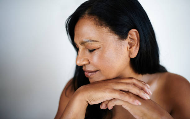 istock Peaceful Mature Woman with Eyes Closed and Relaxed Posture 2202814886
