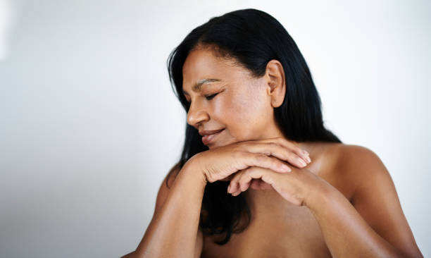 istock Peaceful Mature Woman with Eyes Closed and Relaxed Posture 2202814891