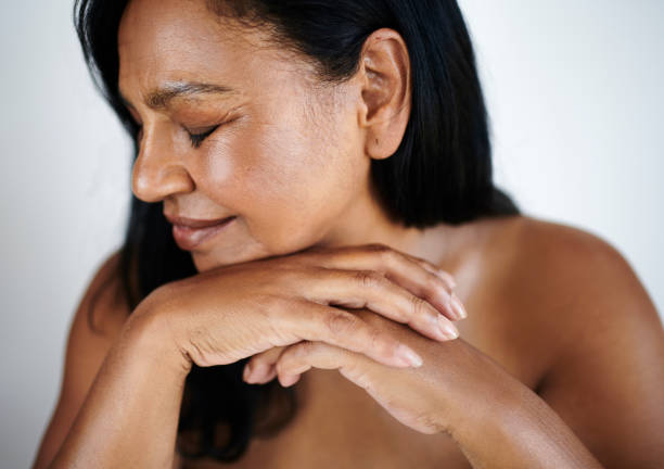 istock Peaceful Mature Woman with Eyes Closed and Relaxed Posture 2202814892
