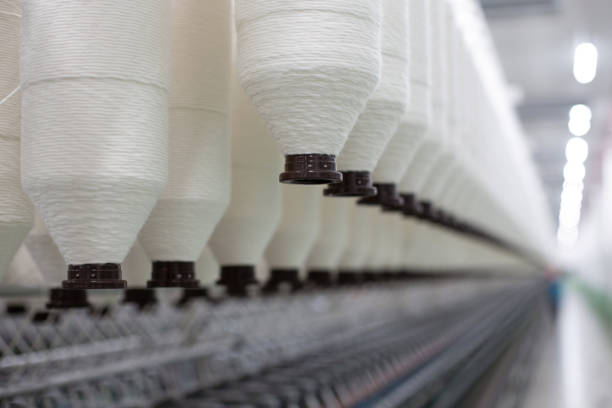 istock Industrial textile factory  Thread bobbins 2202815474